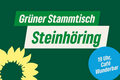 Ein grünes Plakat mit der Aufschrift: "Grüner Stammtisch Steinhöring, 19 Uhr Cafe Wunderbar"